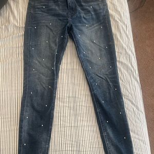 Denim jeans with pearls on front. Excellent condition.
